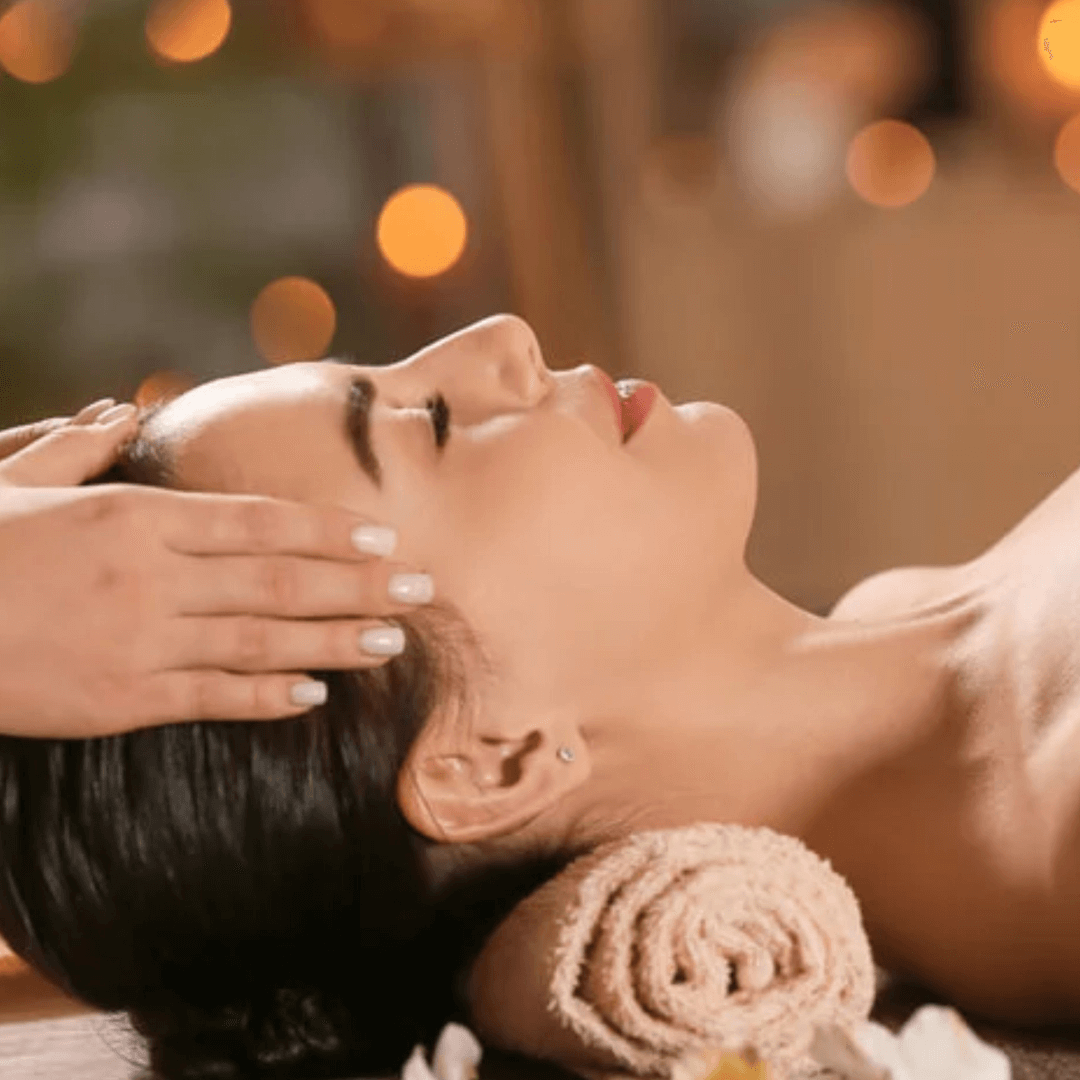 Woman receiving a Reiki massage session.